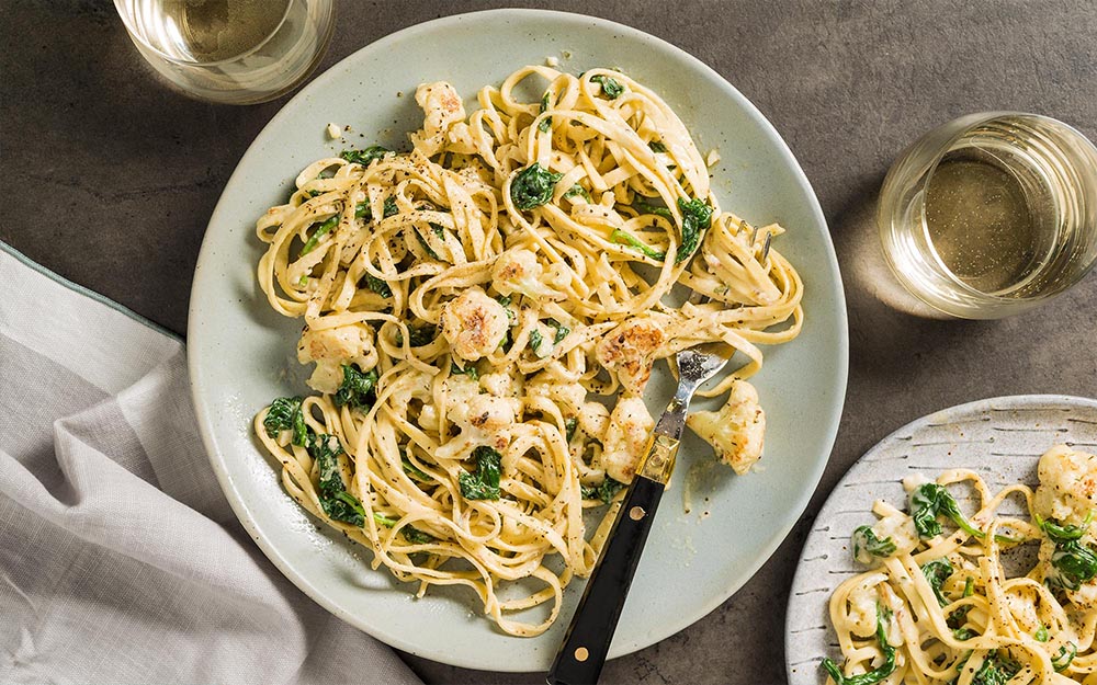 Cauliflower Fettuccine Alfredo with spinach, parmesan and fresh pasta,